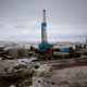 An oil derrick is seen at a fracking site for extracting oil outside of Williston, North Dakota.